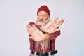 Old senior man with grey hair and long beard wearing hipster look with wool cap rejection expression crossing arms and palms doing Royalty Free Stock Photo