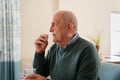 Old senior man taking medicine pill Royalty Free Stock Photo