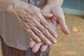Old senior woman hands wrinkled skin