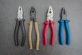 Old set of pliers of different sizes and calibers for home renovations Royalty Free Stock Photo