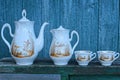 An old set of two white teapots and cups with a brown pattern Royalty Free Stock Photo