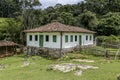 Old settler house in green landscape