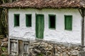 Old settler house in green landscape