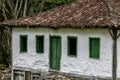 Old settler house in green landscape