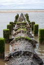 An old sewer pipe reaches out into the Irish Sea off Blackpool\'s beach Royalty Free Stock Photo