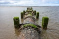 An old sewer pipe reaches out into the Irish Sea off Blackpool\'s beach Royalty Free Stock Photo