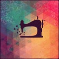 Old sewing machine on hipster background made of triangles with