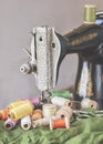 Old sewing machine and vintage spools of thread/.