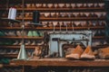 An old sewing machine with wooden shoe models in backgorund Royalty Free Stock Photo