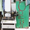 Old sewing Singer machine as part of a window display in an antic shop Royalty Free Stock Photo