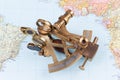 old brass sextant lying on world map Royalty Free Stock Photo