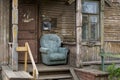 Chair on entrance porch of vintage wooden city house with carved wooden elements