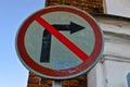 Old shabby cracked round iron road sign prohibiting the right turn is prohibited. The background Royalty Free Stock Photo