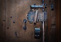 Old shabby door with metal lock handle Royalty Free Stock Photo