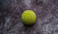 Old shabby and dusty green tennis ball Royalty Free Stock Photo