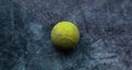 Old shabby and dusty green tennis ball Royalty Free Stock Photo