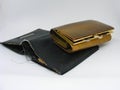Old shabby empty wallet with elegant golden wallet with monney Royalty Free Stock Photo