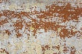 Old shabby gray white concrete wall with scratches and brown red peeling paint. rough surface texture Royalty Free Stock Photo