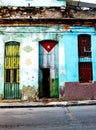 Old shabby house in Central Havana painted with the Cuban flag a Royalty Free Stock Photo