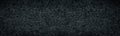 Old shabby iron metal wide black texture. Rough textured dark gray surface panorama. Abstract grunge background