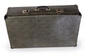 Old shabby leatherette hardshell suitcase on a white background