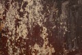 Old shabby rusty metal wall. Shabby, cracked brown paint. Grunge background Royalty Free Stock Photo