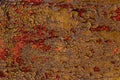 Old shabby rusty metal wall. Shabby, cracked brown paint. Grunge background Royalty Free Stock Photo