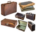 Old shabby vintage suitcases and book isolated on white background. Retro style