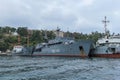 Old shabby warships of the Russian Black Sea Fleet in the port of Sevastopol. Royalty Free Stock Photo