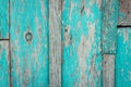 Old shabby wooden background with flaking blue paint