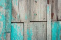 Old shabby wooden background with flaking blue paint