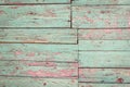 Old shabby wooden background with flaking green paint