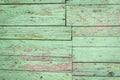 Old shabby wooden background with flaking green paint