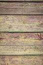 Old shabby wooden background with flaking green paint