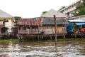 Old shacks, poor neighborhoods on the water of the river. Thailand Bangkok.