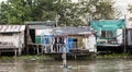 Old shacks, poor neighborhoods on the water of the river. Thailand Bangkok.