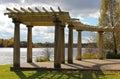 Old shaded arbor over Seneca lake. Royalty Free Stock Photo