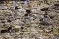 Old shapeless stones create the texture of stone cladding Royalty Free Stock Photo