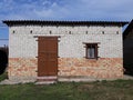 Old shed of red and white brick Royalty Free Stock Photo