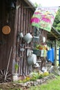 An old shed wall filled full of buckets and antiques. Royalty Free Stock Photo