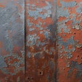 Old sheet of iron covered in rust, adorned with multicolored paint Royalty Free Stock Photo