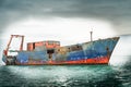 Old ship on calm sea a wreck still floating. Royalty Free Stock Photo