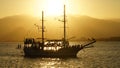 Old ship crossing sun path Royalty Free Stock Photo