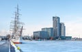 Old ship on frozen sea and busyness building Royalty Free Stock Photo