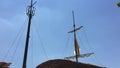 Old ship mast and sail swaying by wind. Concept sea pirat filibuster sky background.