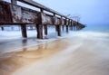 Old ship pier and sea wave in storming season