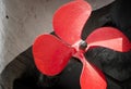 The old ship propeller is painted red. Museum piece. Royalty Free Stock Photo