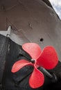 The old ship propeller is painted red. Museum piece. Royalty Free Stock Photo