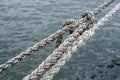 Old ship ropes tightened closeup