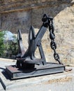 Old ship's anchor near the ancient fortress wall